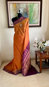 MORVIKA – BURNT ORANGE GADWAL SILK  WITH PURPLE FLORAL ZARI