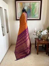 MORVIKA – BURNT ORANGE GADWAL SILK  WITH PURPLE FLORAL ZARI