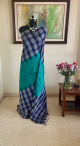 RINIKA - TEAL KANJIVARAM WITH NAVY CHECKS BORDER