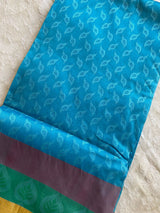 MEENA- A BLUE, SILK BLEND SAREE WITH COUNCH SHELL SHAPED MOTIFS, A MULTILAYERED BORDER AND BRIGHT RED AANCHAL