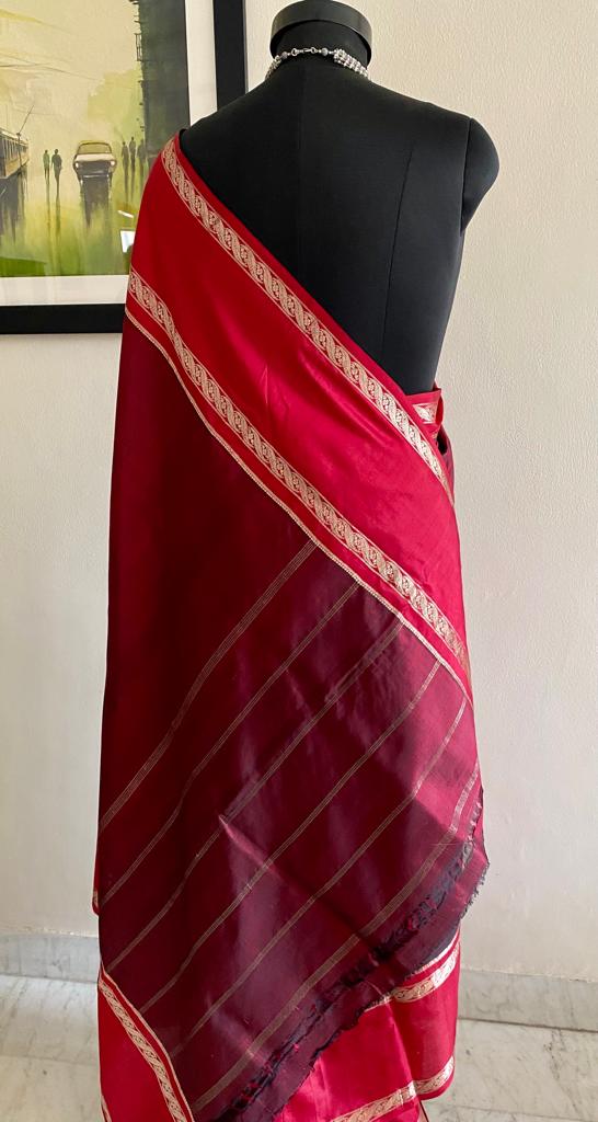 AMARA- TIMELESS ELEGANCE, WINEISH MAROON KANJIVARAM SAREE WITH A STRIKING RED BORDER AND PURE ZARI ALONG THE BORDER