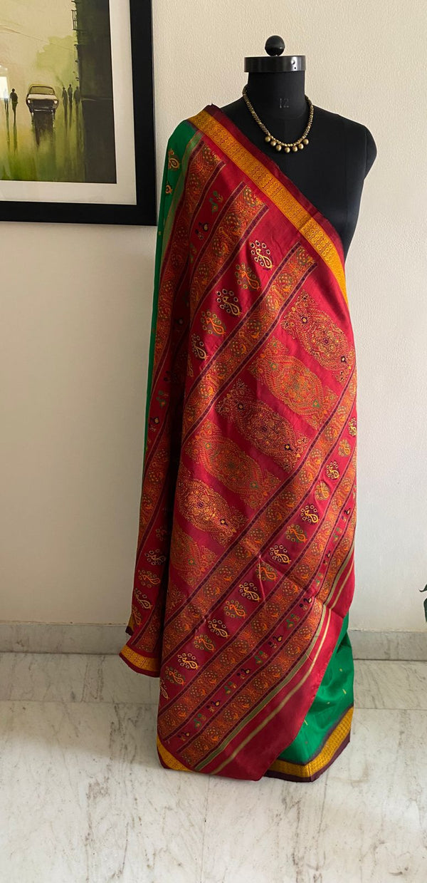 DEBASMITA- A BEAUTIFUL BOMKAI SILK IN GREEN WITH A FULLY WOVEN RED BORDER AND AANCHAL