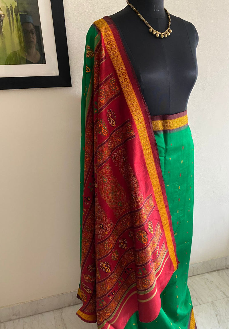 DEBASMITA- A BEAUTIFUL BOMKAI SILK IN GREEN WITH A FULLY WOVEN RED BORDER AND AANCHAL