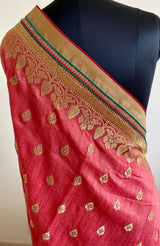 MAMTA- A BLUSH PINK TUSSAR SILK SAREE WITH WOVEN DULL GOLD ZARI BOOTIS AND FULLY WOVEN ZARI BORDER AND AANCHAL