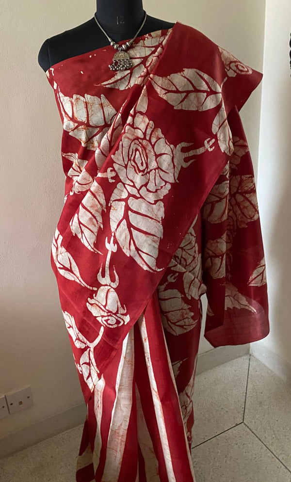 NYRA- A BEAUTIFUL RUST SILK PATLI SAREE WITH FLORAL TIE AND DYE IN SHADES OF OFFWHITE AND PATLI AS RUST AND OFFWHITE STRIPES