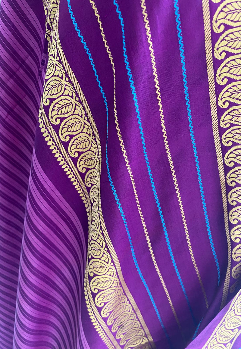 MAANVI- AN UNUSUAL SOFT MADURAI SILK SAREE  IN LIGHT AND DARK PURPLE STRIPES AND WOVEN BORDER AND AANCHAL