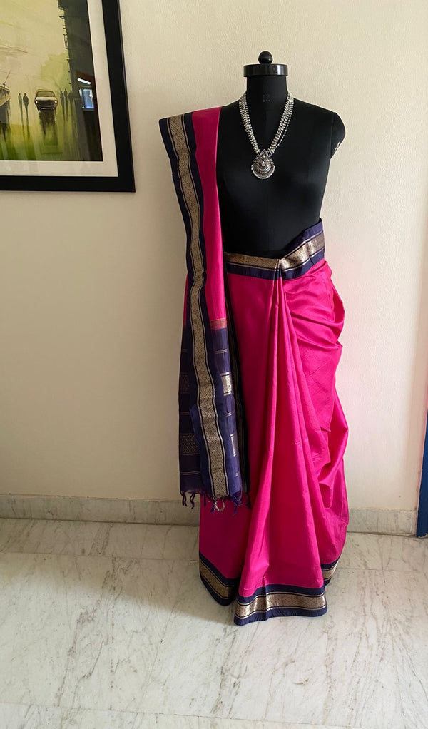 BHAVIKA- A BEAUTIFUL HANDLOOM KORVAI KANJIVARAM IN RANI PINK WITH NAVY BLUE  AND SILVER ZARI BORDER AND AANCHAL