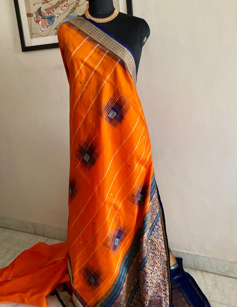 JHILLI- ELEGANCE UNVEILED, CAPTIVATING ODISHA HANDLOOM SILK SAREE IN ORANGE AND DARK NAVY BLUE