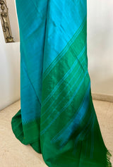 SUNEHA – SHOT BLUE KANJIVARAM WITH GREEN BLUE PEACOCK BORDER