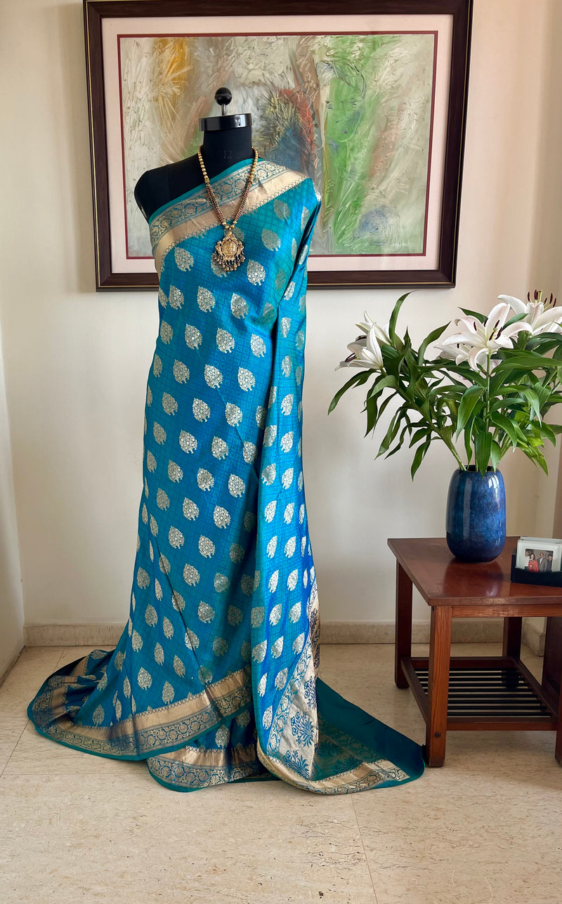 DEVALIKA – SHOT BLUE BANARASI WITH GOLD FLORAL MOTIFS