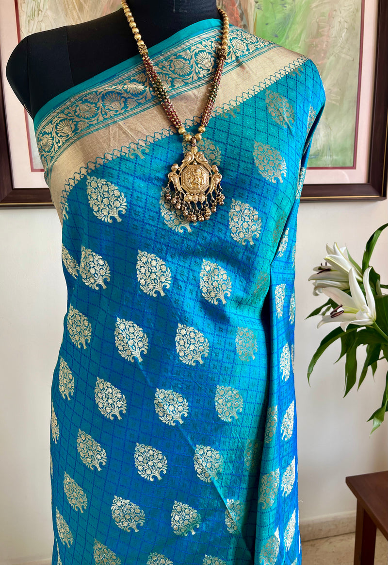 DEVALIKA – SHOT BLUE BANARASI WITH GOLD FLORAL MOTIFS