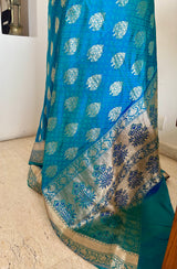DEVALIKA – SHOT BLUE BANARASI WITH GOLD FLORAL MOTIFS