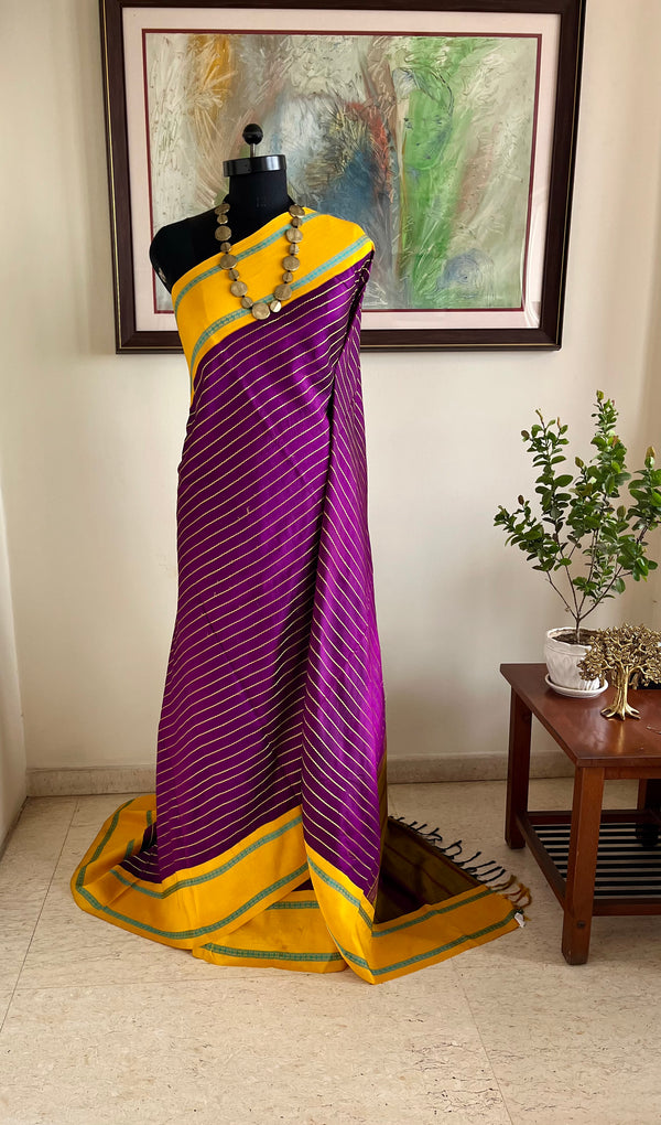 SHANKARI – VELDHARI KANJIVARAM IN RICH PURPLE WITH YELLOW BORDER DETAILS