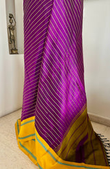 SHANKARI – VELDHARI KANJIVARAM IN RICH PURPLE WITH YELLOW BORDER DETAILS