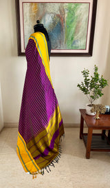 SHANKARI – VELDHARI KANJIVARAM IN RICH PURPLE WITH YELLOW BORDER DETAILS