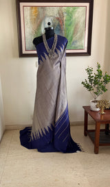 KAIRA – SILVER GREY KANJIVARAM WITH BLUE STRIPES AND TEMPLE BORDERS