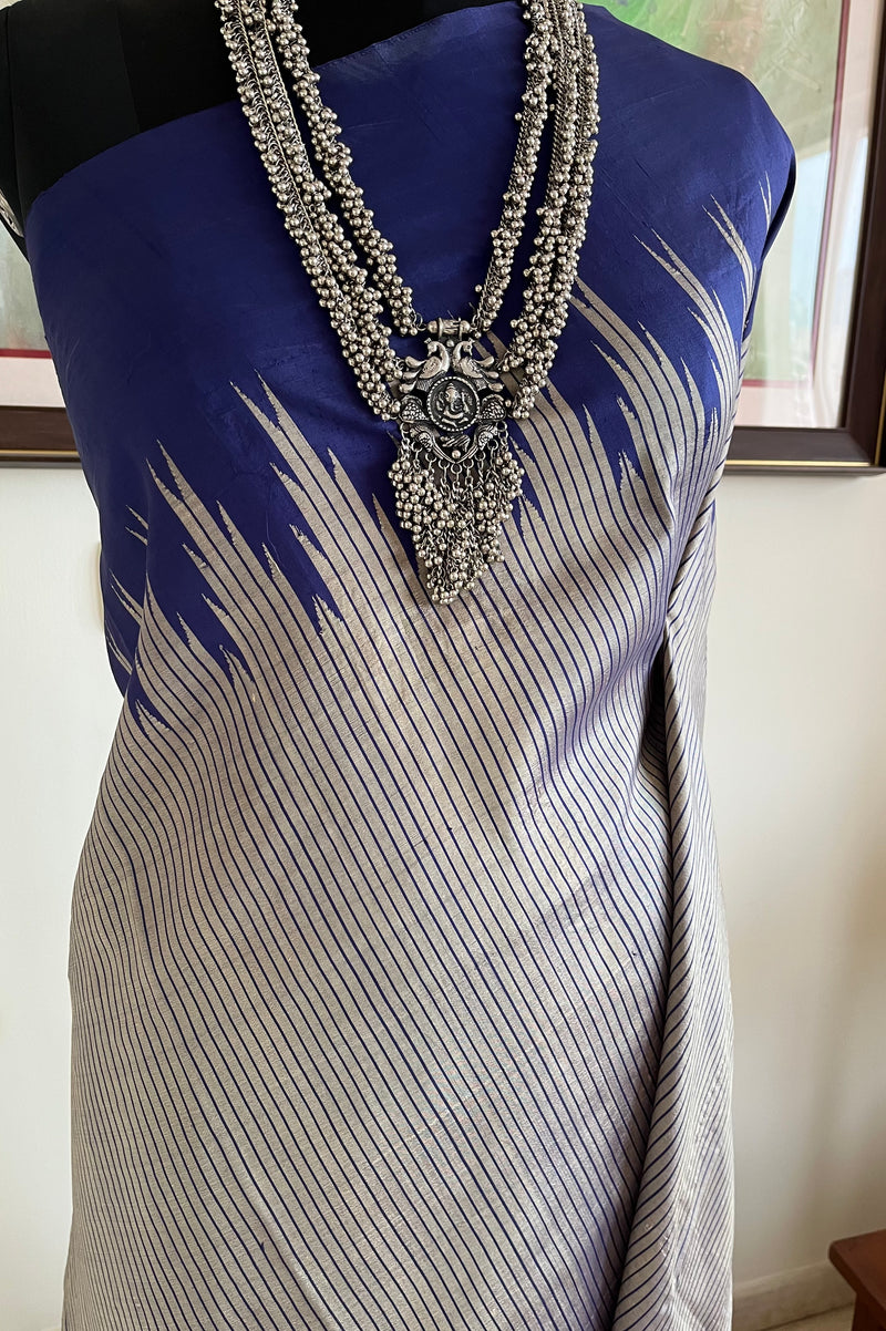 KAIRA – SILVER GREY KANJIVARAM WITH BLUE STRIPES AND TEMPLE BORDERS