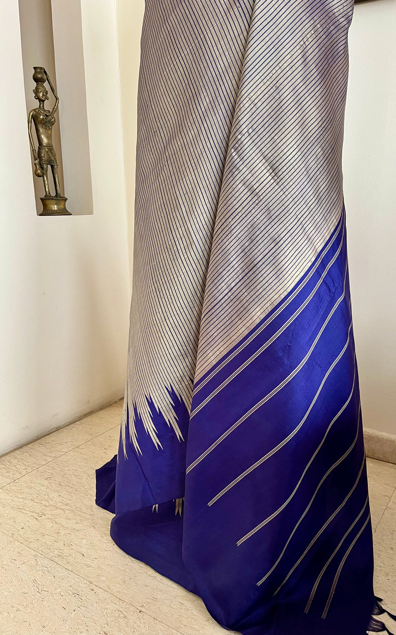 KAIRA – SILVER GREY KANJIVARAM WITH BLUE STRIPES AND TEMPLE BORDERS