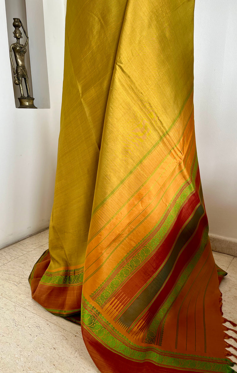 RITHYA – OCHRE KANJIVARAM WITH GREEN LINES AND RUST BORDERS