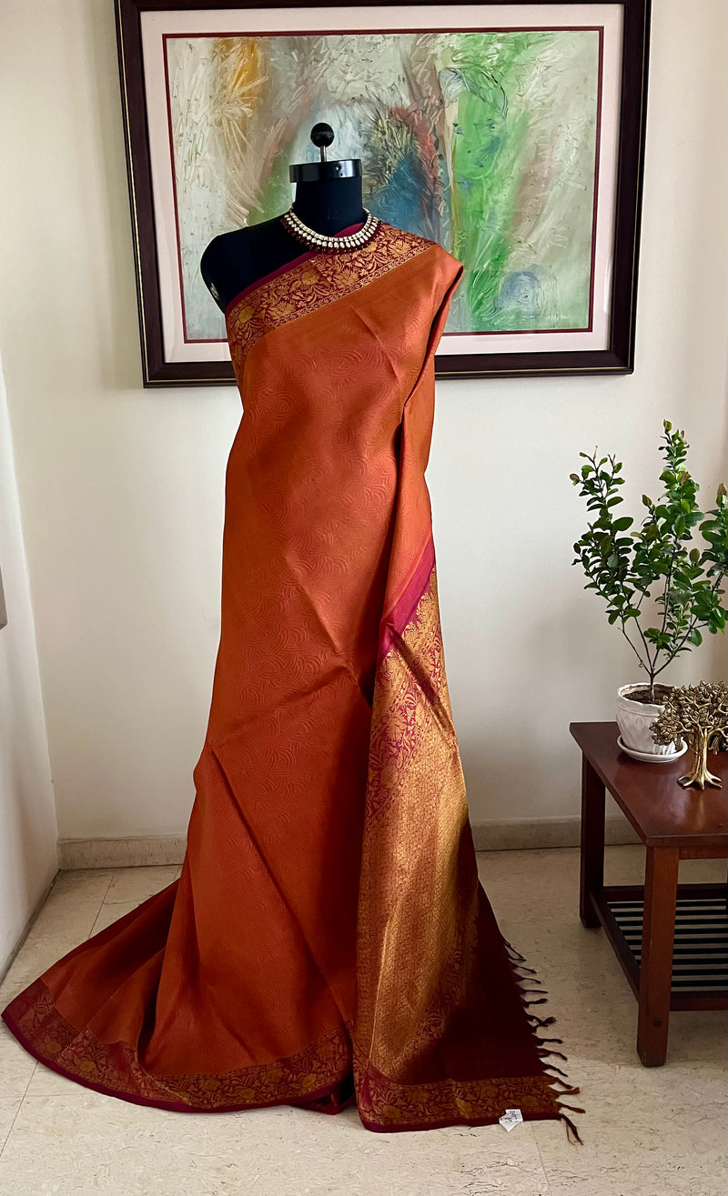 VAISHU – RUST BROWN KANJIVARAM SAREE WITH FLORAL ZARI BORDER