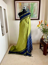 SAYURI – LEAF GREEN KORVAI KANJIVARAM WITH NAVY BLUE BORDERS