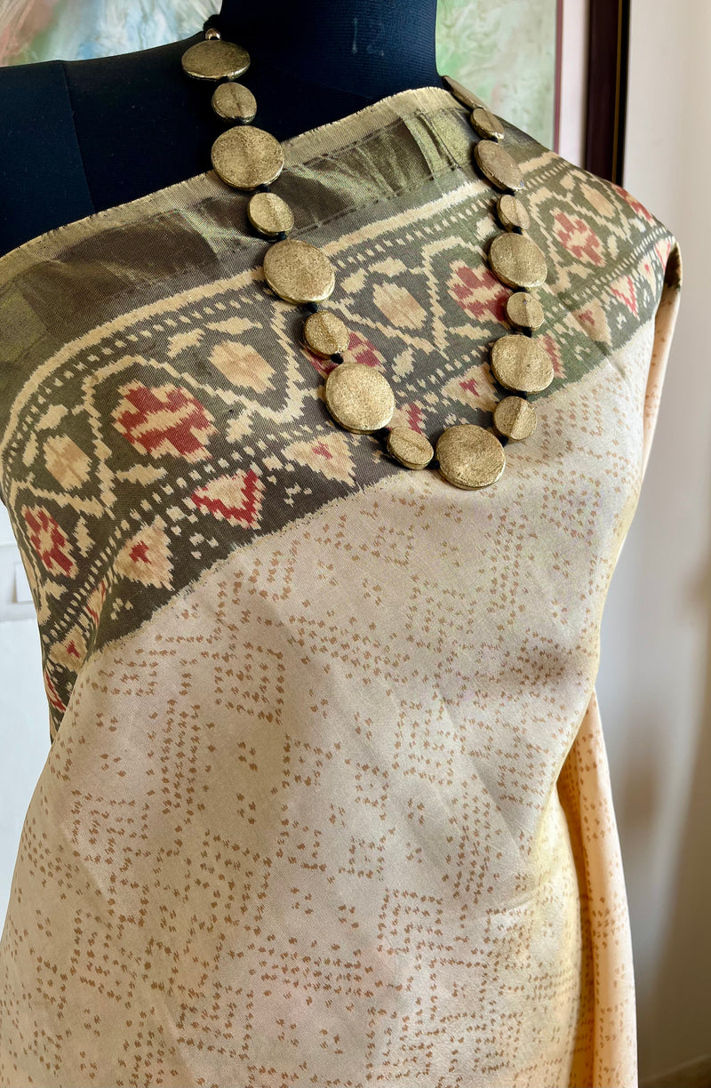 AADHIRA- BEIGE IKKAT SAREE ; FLORAL ELEGANCE, ZARI ACCENTS, TIMELESS ARTISTRY