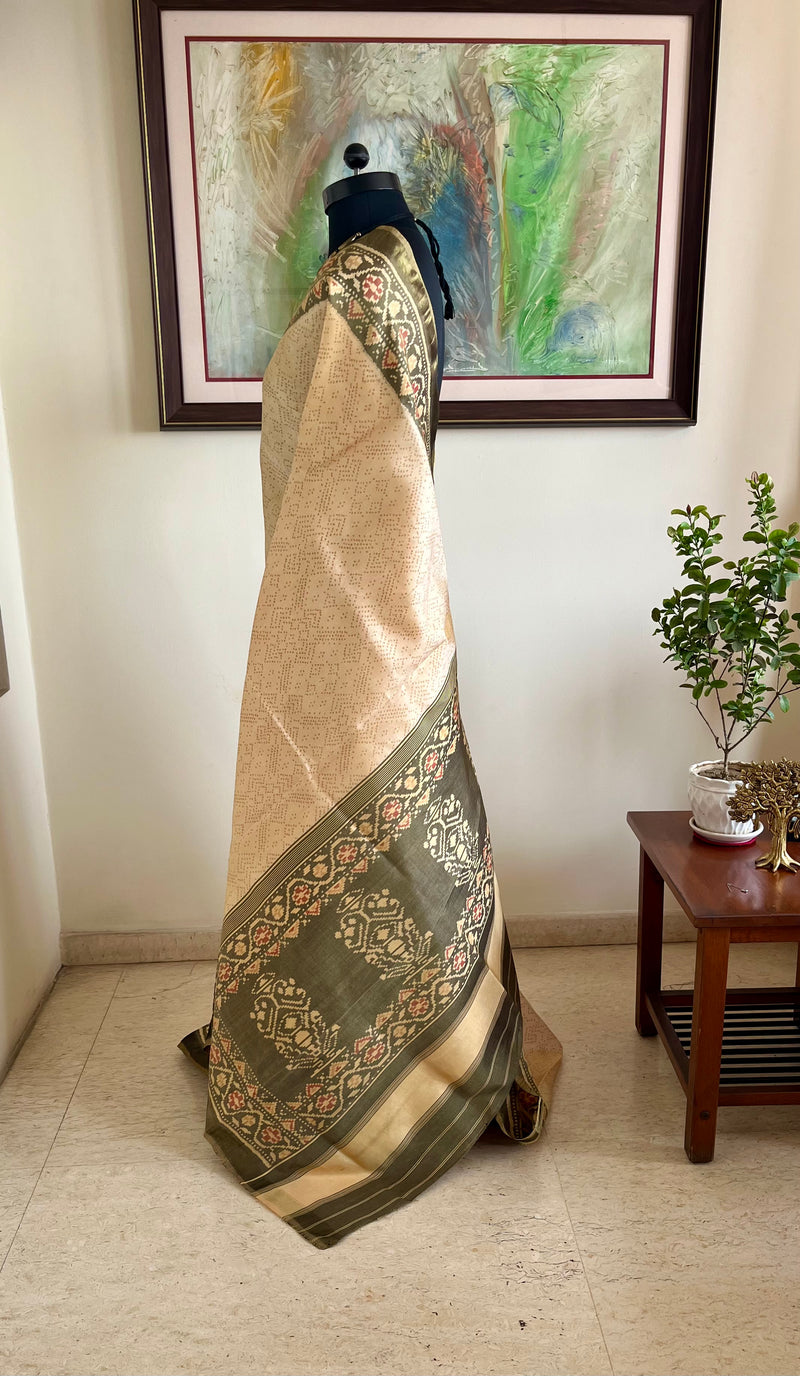 AADHIRA- BEIGE IKKAT SAREE ; FLORAL ELEGANCE, ZARI ACCENTS, TIMELESS ARTISTRY