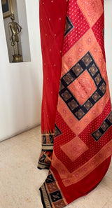 SUVINA — RUST BOMKAI SILK WITH A STRIKING GEOMETRIC AANCHAL