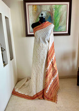 JUTHIKA – WHITE ASSAM SILK WITH RED AND MUSTARD FLORALS