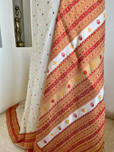 JUTHIKA – WHITE ASSAM SILK WITH RED AND MUSTARD FLORALS