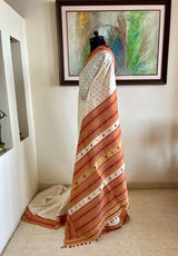 JUTHIKA – WHITE ASSAM SILK WITH RED AND MUSTARD FLORALS