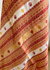 JUTHIKA – WHITE ASSAM SILK WITH RED AND MUSTARD FLORALS