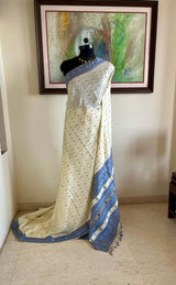 SUBORNA – CREAM ASSAM SILK WITH BLUE FLORAL MOTIFS