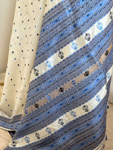 SUBORNA – CREAM ASSAM SILK WITH BLUE FLORAL MOTIFS