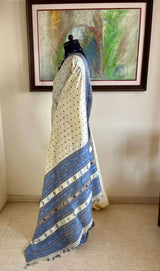 SUBORNA – CREAM ASSAM SILK WITH BLUE FLORAL MOTIFS