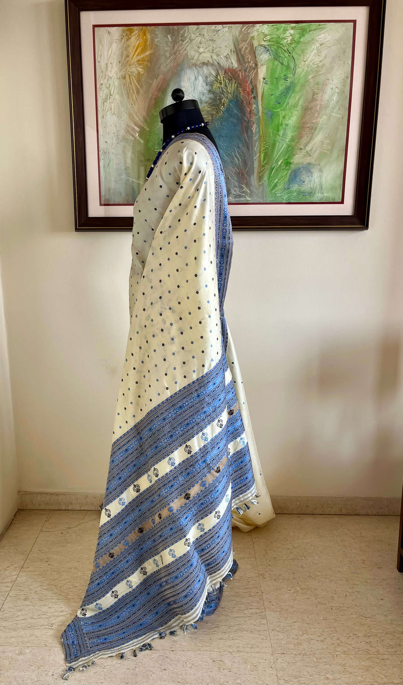 SUBORNA – CREAM ASSAM SILK WITH BLUE FLORAL MOTIFS