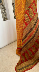 AVEYA- MUSTARD PURE GEORGETTE WITH BAGH PRINT CONTRASTS