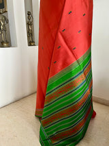 MAENIKA – RUST KANJIVARAM WITH GREEN BORDER AND AANCHAL