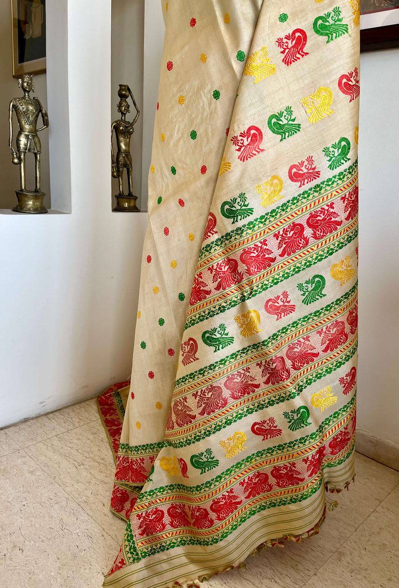REENU – CREAM ASSAM TUSSAR SILK SAREE WITH MULTICOLOR MOTIFS