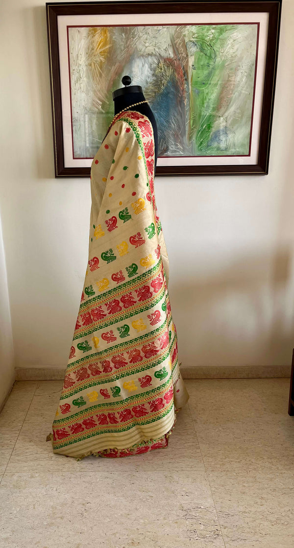 REENU – CREAM ASSAM TUSSAR SILK SAREE WITH MULTICOLOR MOTIFS