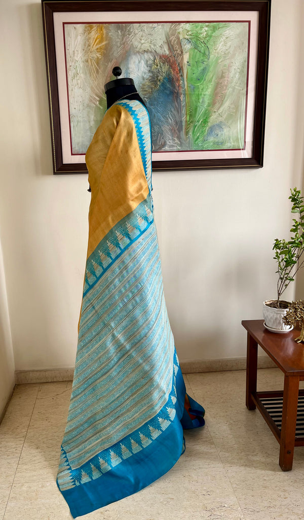 AVNIYA – BEIGE CREAM TUSSAR WITH BLUE TEMPLE BORDER AANCHAL