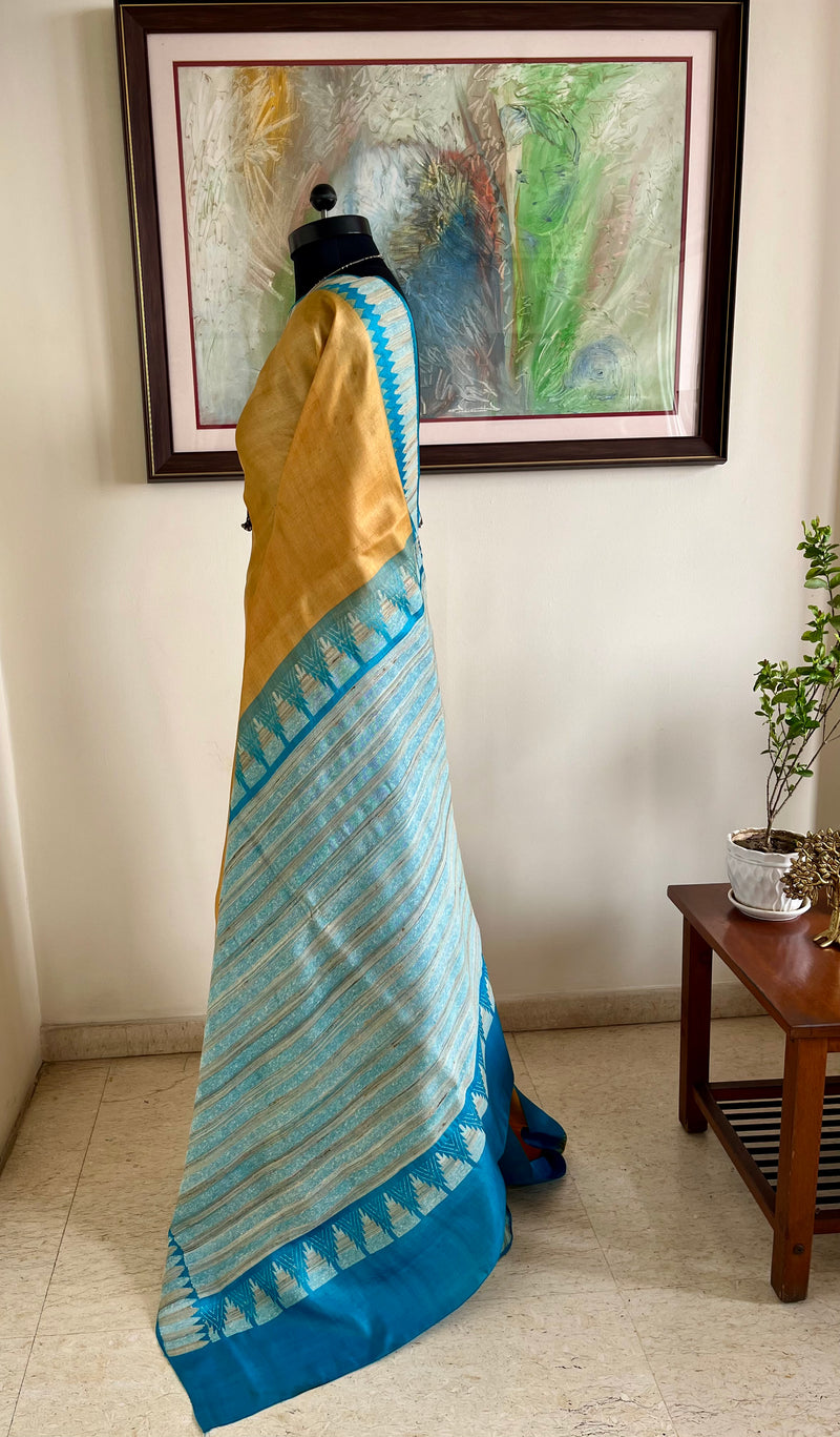 AVNIYA – BEIGE CREAM TUSSAR WITH BLUE TEMPLE BORDER AANCHAL