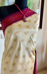 DHANURIKA – CREAM PUTAPAKKA IKKAT WITH MAGENTA AANCHAL