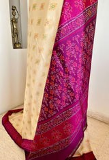 DHANURIKA – CREAM PUTAPAKKA IKKAT WITH MAGENTA AANCHAL