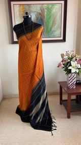 KALPINI — RUST KANJIVARAM SILK WITH BOLD BLACK CONTRASTS