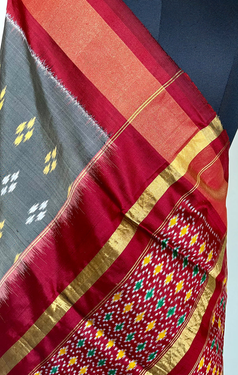 AAKARSHA- GREY RAJKOT PATOLA WITH MAROON, ORANGE AND ZARI ACCENTS