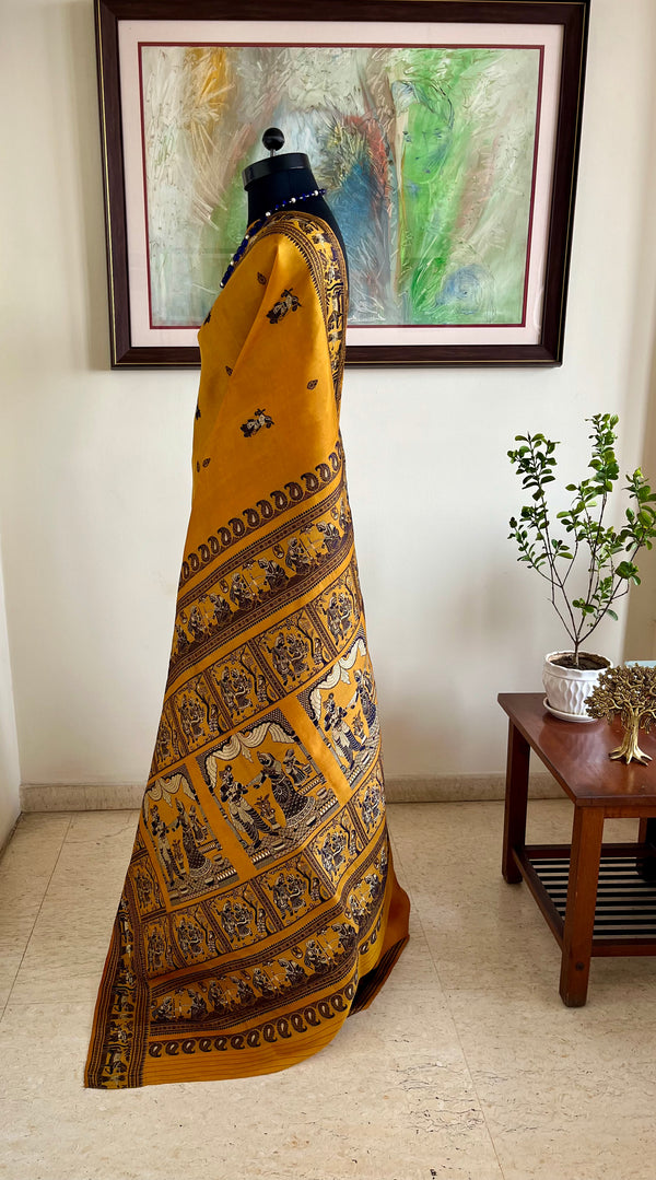 ARSHI- MUSTARD BALUCHARI WITH BLACK MOTIFS AND MYTHOLOGICAL ANCHAL