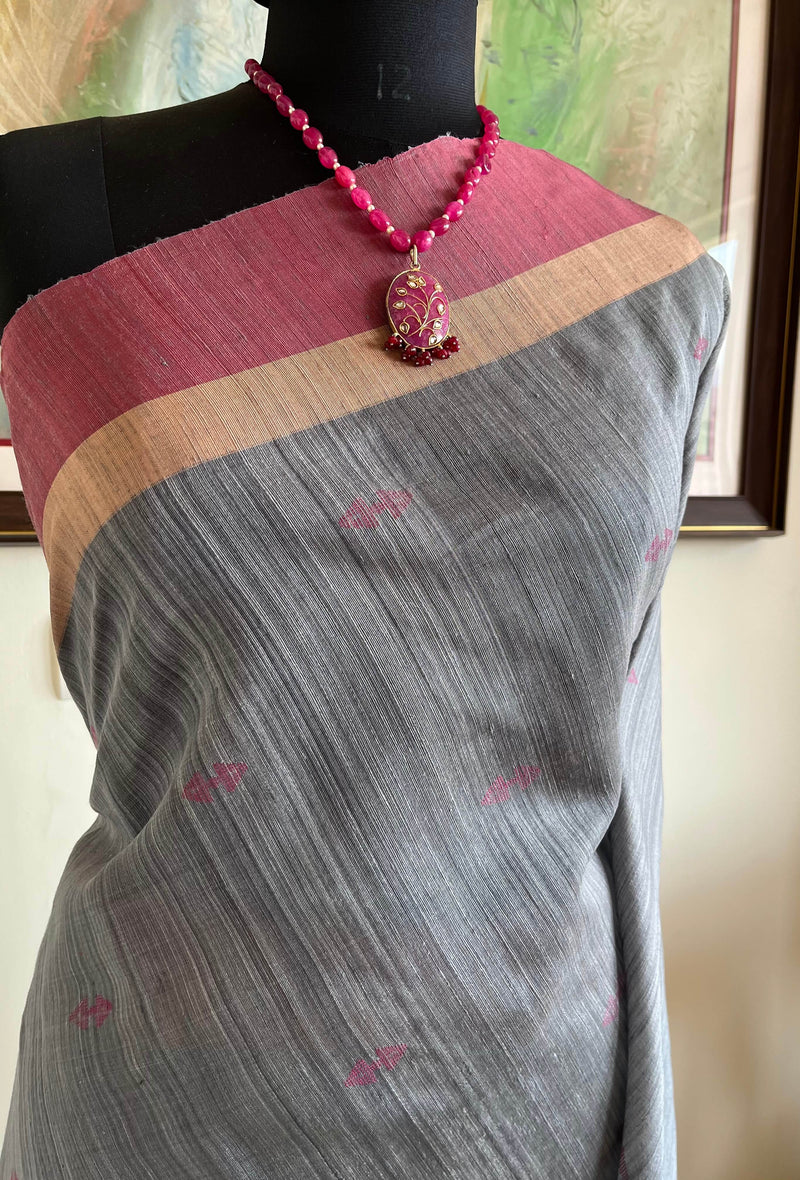 AAVAYA-GREY TUSSAR WITH PINK PEACH BORDER AND MOTIFS