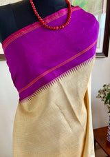 KARTIKA-KORVAI KANJIVARAM IN CREAM WITH PURPLE PETNI AANCHAL