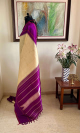 KARTIKA-KORVAI KANJIVARAM IN CREAM WITH PURPLE PETNI AANCHAL